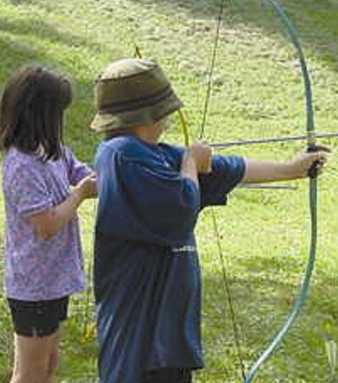 Archers just about to raise their elbows to the proper height before firing